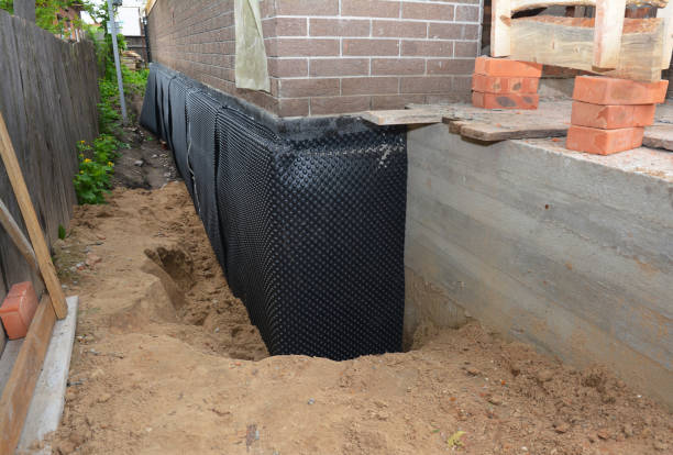 SJ Waterproofing Pros technician performing targeted Foundation Crack Repair assessment in Peachtree Corners, GA